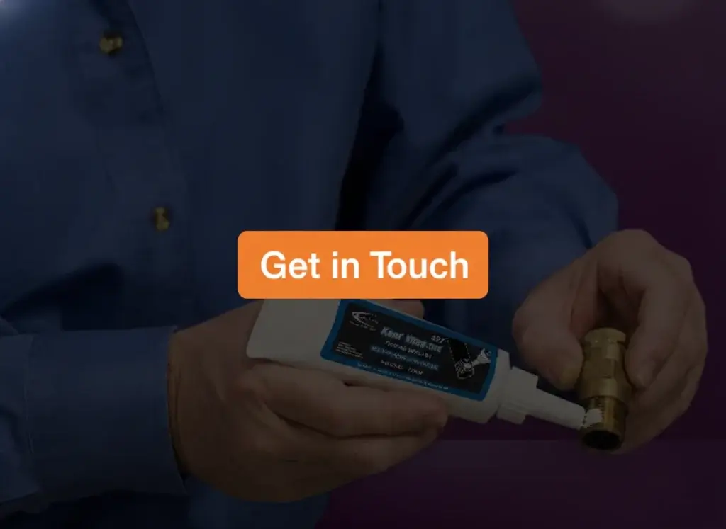 Industrial Worker Applying Loctite to Pipe Joints